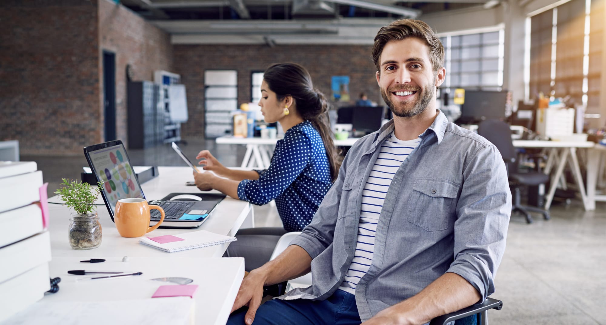 Smiling gentleman at a desk